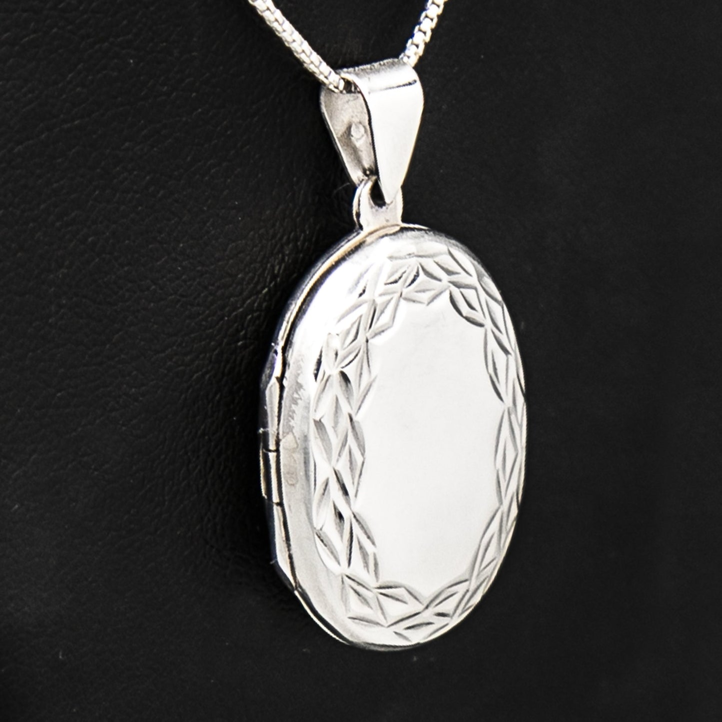 Large Oval locket necklace on Italian silver chain, displayed on black bust.
