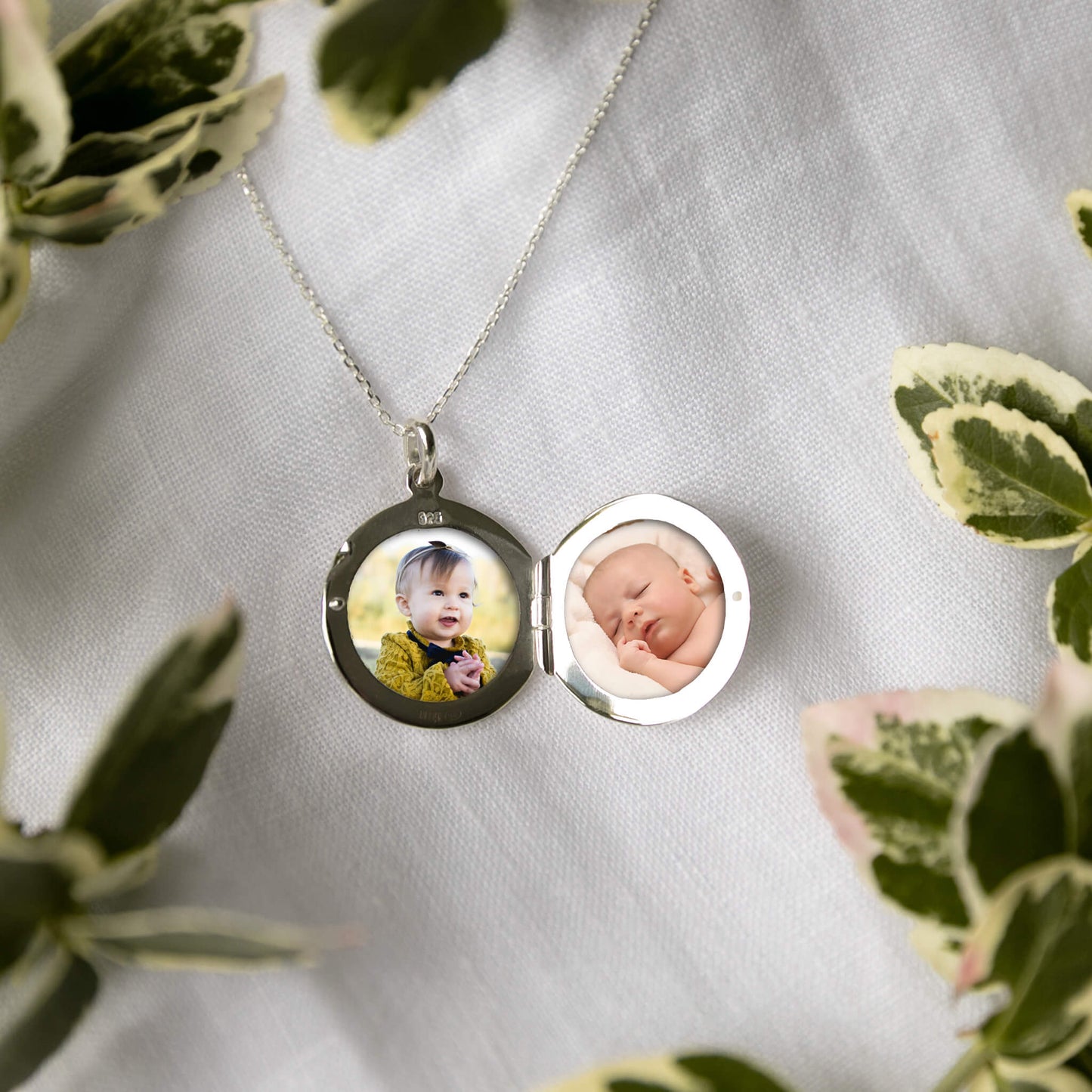 round photo locket showing two photos