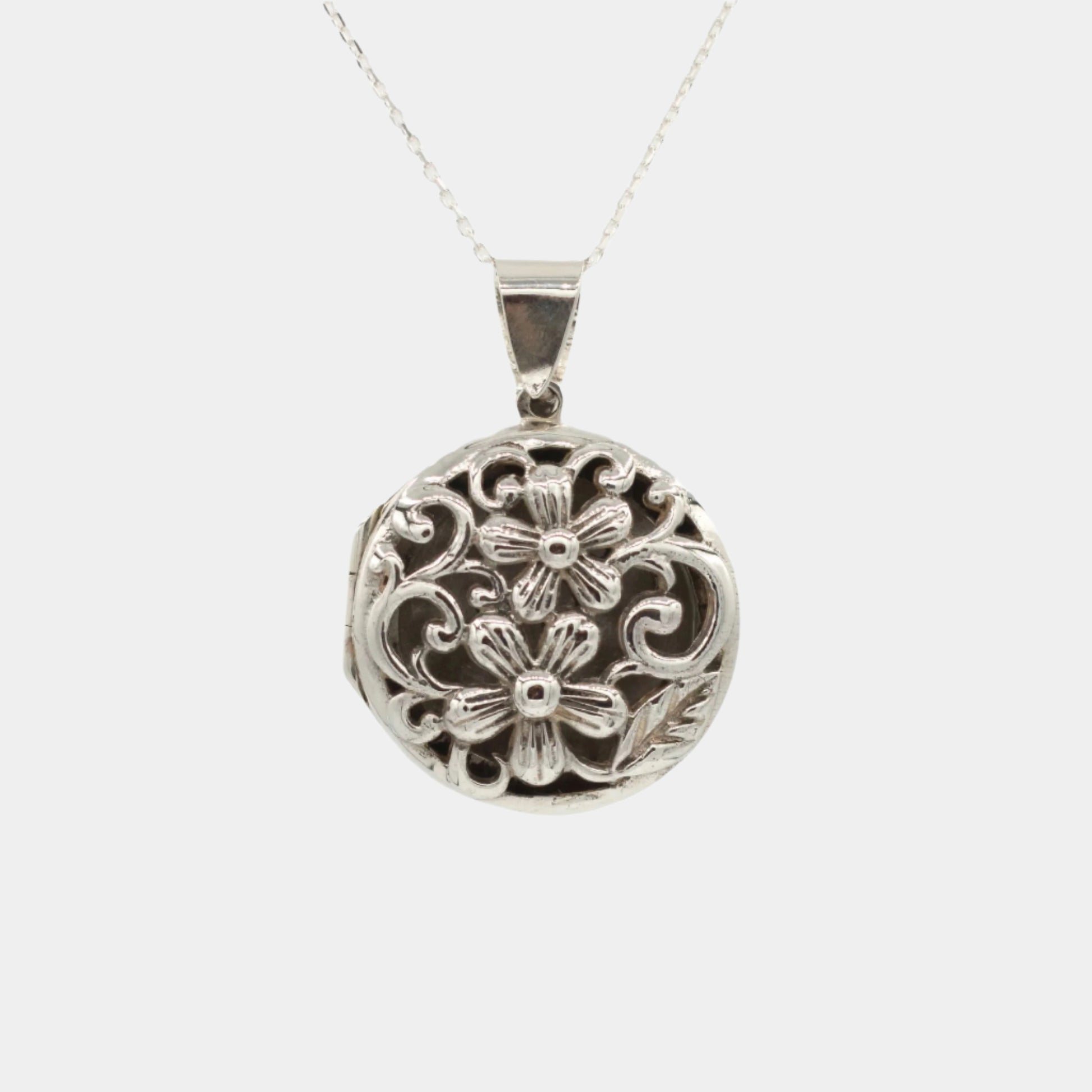 Large silver locket with flower detail