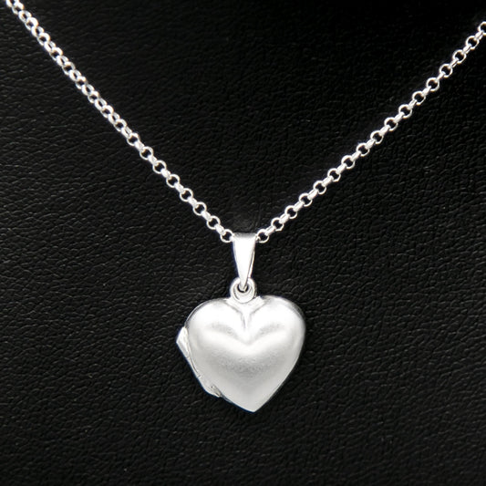 Silver heart shaped photo locket necklace on Italian silver chain against black background