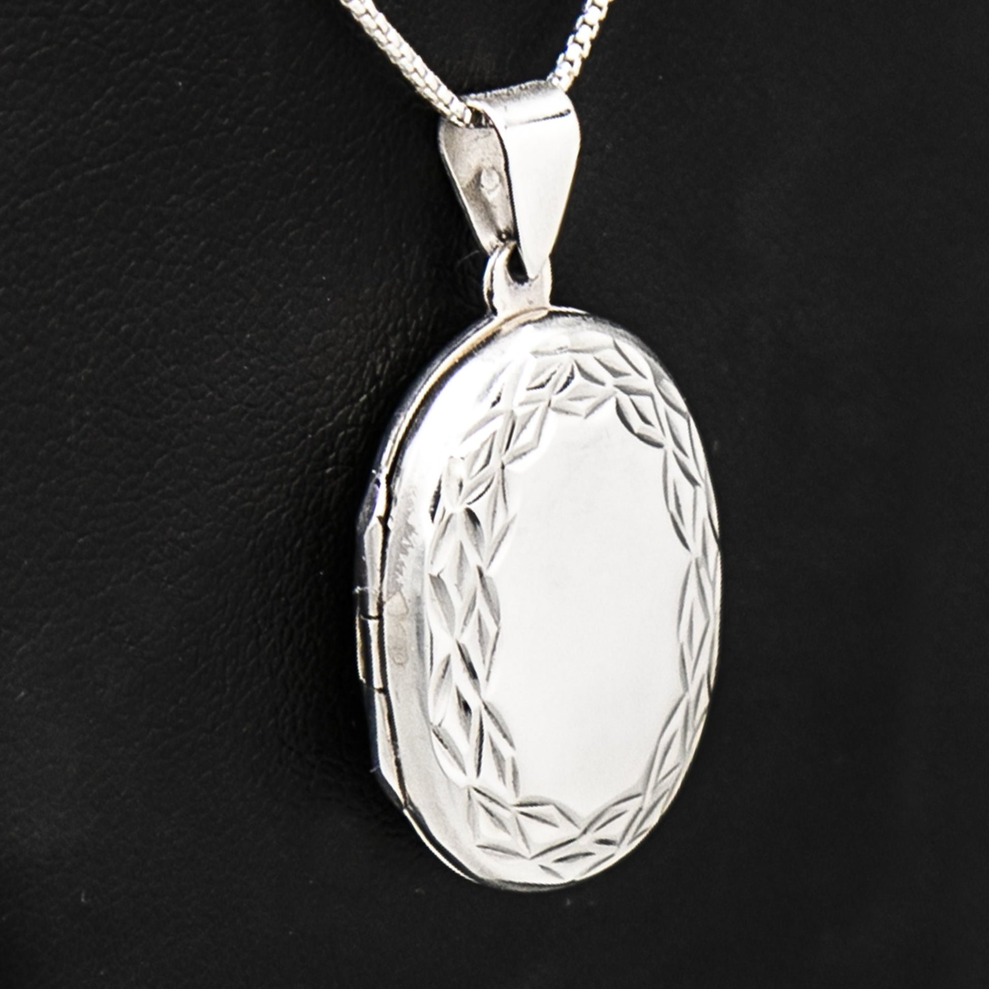 Large Oval locket necklace on Italian silver chain, displayed on black bust.
